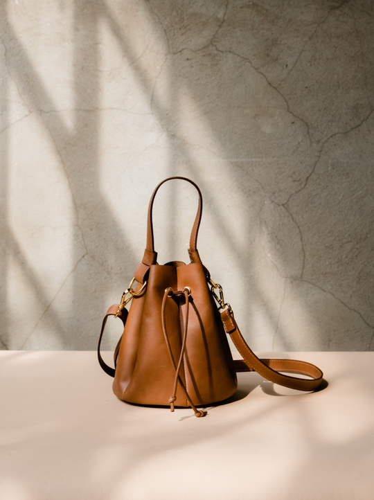 Adorable tan hotsell pleated crossbody bucket bag.