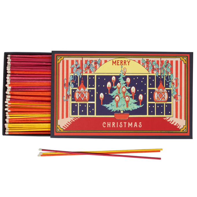 A huge (makes a statement), colorful Christmas themed matchbox filled with 150 long fireplace matches for making spirits (and fires) bright!